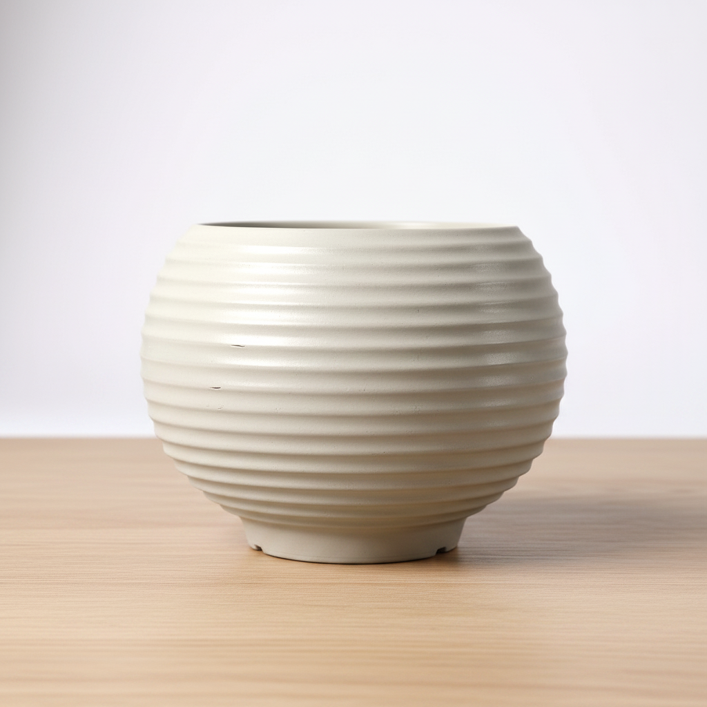 White ribbed ceramic vase on a white background