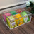 Clear acrylic organizer with tea bags on a wooden surface